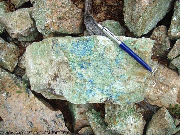 Sample with secondary copper minerals (probably azurite and malachite) in coarse pegmatite