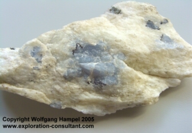 Marosohihy Mine: subhedral, bright blue corundum (3 cm wide) in white plagioclasite.